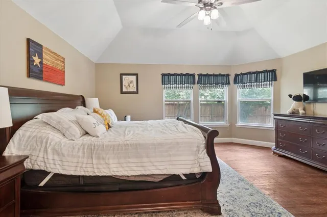 a spacious bathroom with a tub double sink and mirror