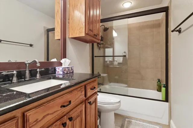 a kitchen with a sink and a refrigerator