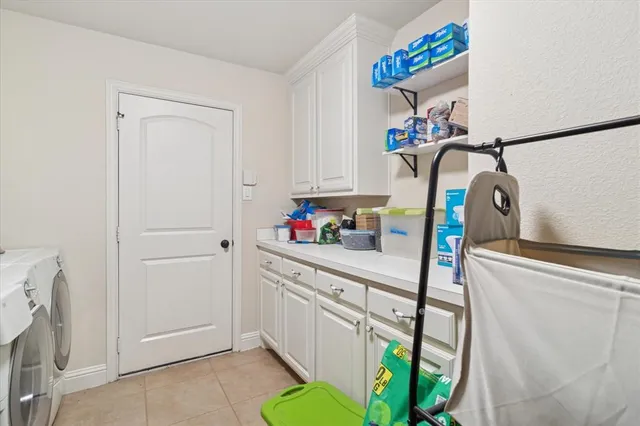 a view of a house with a yard and porch