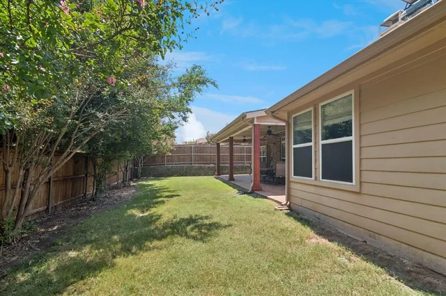 a view of a livingroom with furniture and a window