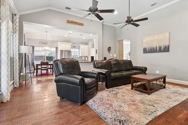 a kitchen with stainless steel appliances a refrigerator sink and cabinets