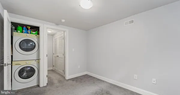 a view of a storage & utility room with a washer and dryer