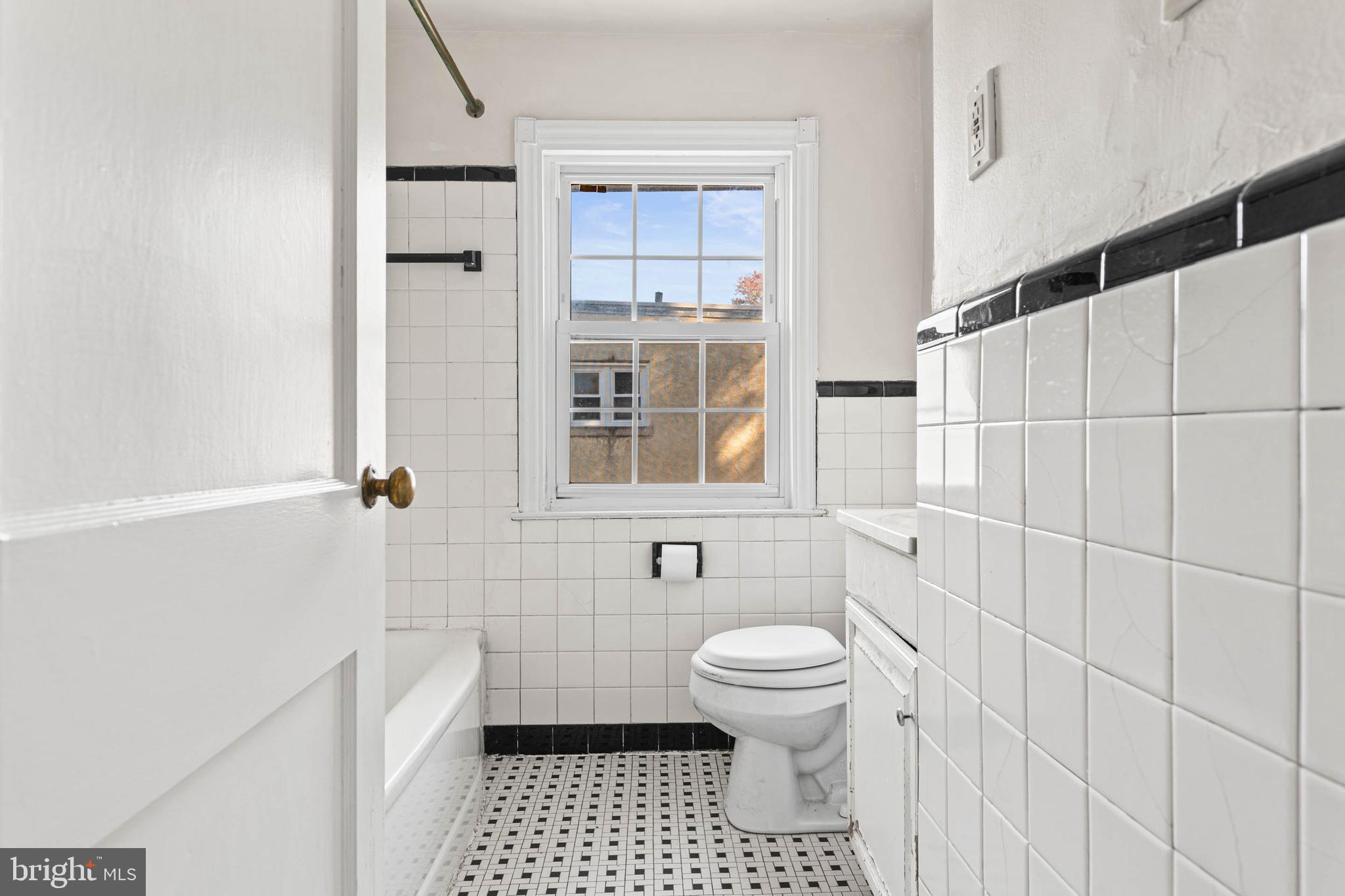 703 Humphreys Road Ardmore, PA 19003 - Photo 20 of 26 a bathroom with a toilet a window and shower