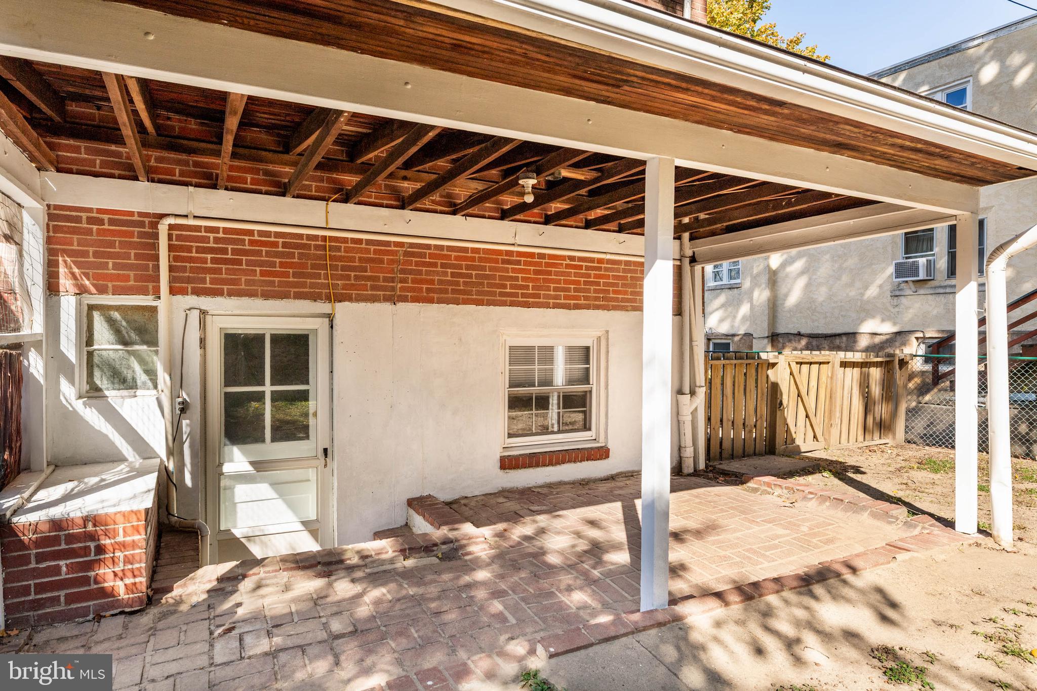 703 Humphreys Road Ardmore, PA 19003 - Photo 25 of 26 a view of a porch with a table and chairs