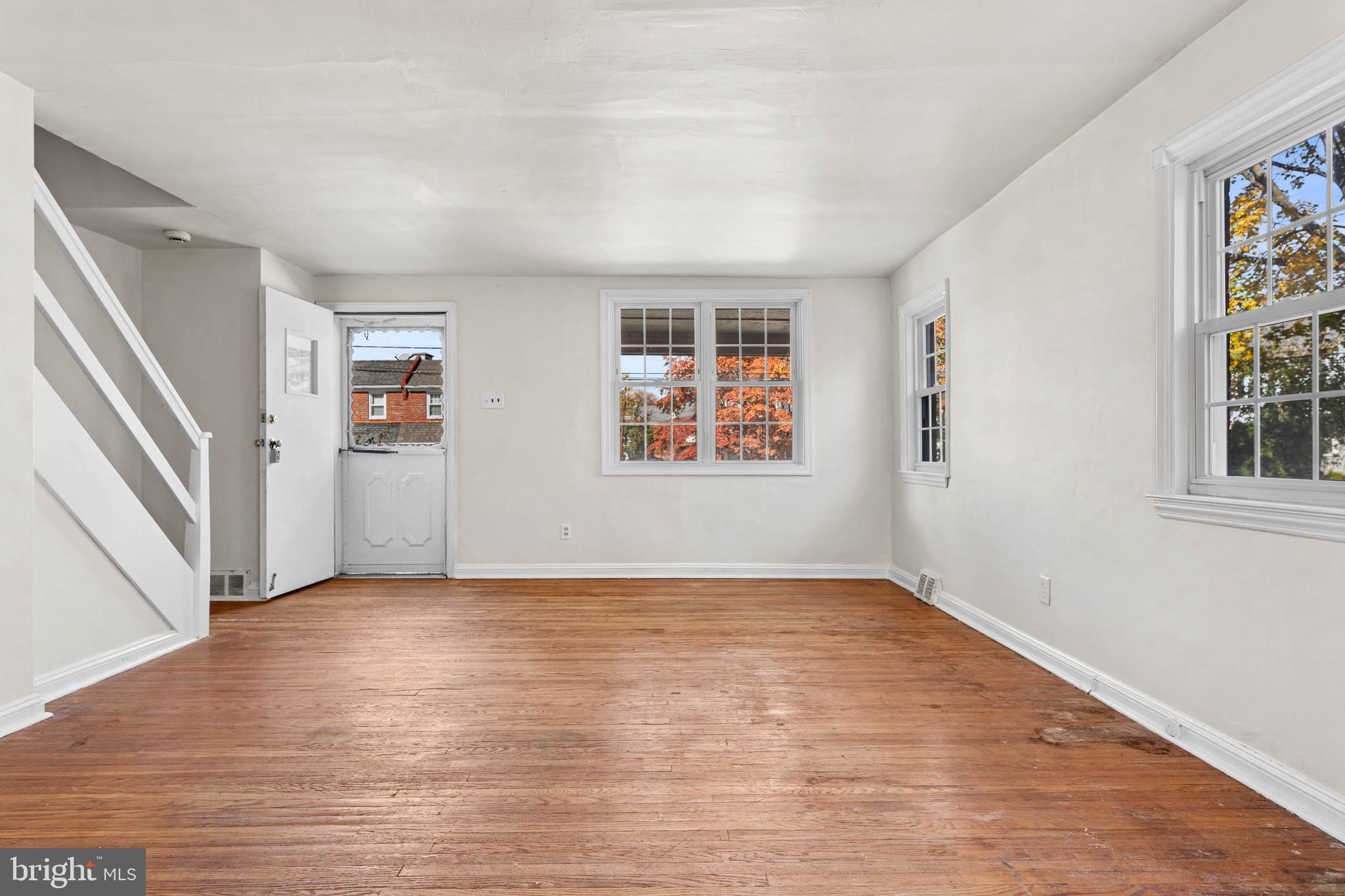 703 Humphreys Road Ardmore, PA 19003 - Photo 4 of 26 wooden floor in an empty room with a window