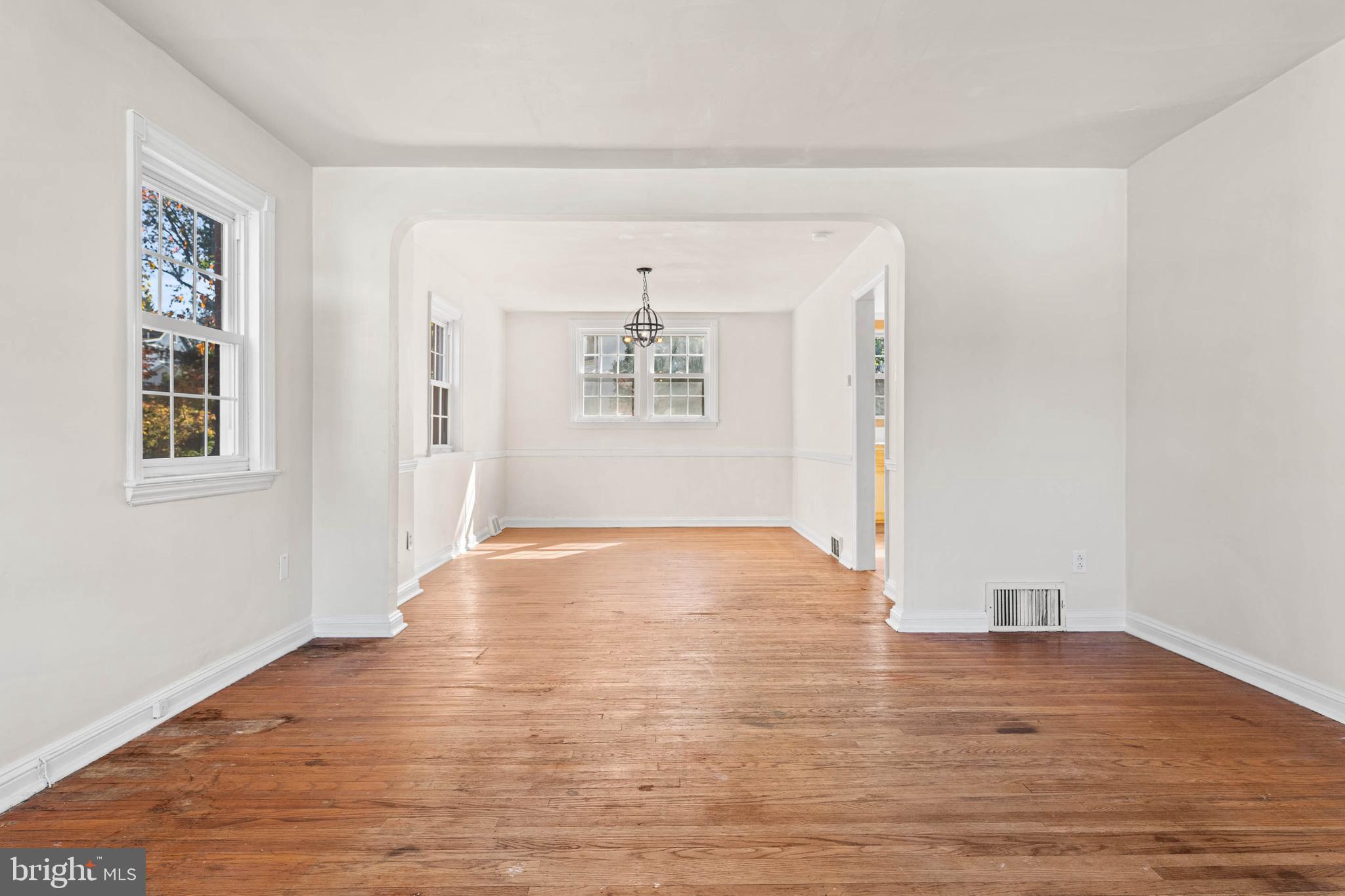 703 Humphreys Road Ardmore, PA 19003 - Photo 6 of 26 a view of empty room with wooden floor and fan
