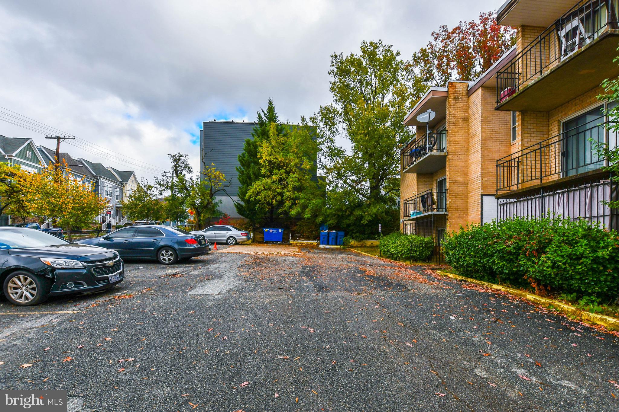 a view of street with parked cars