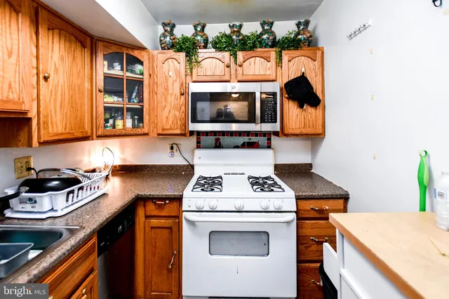 a kitchen with a stove and a microwave