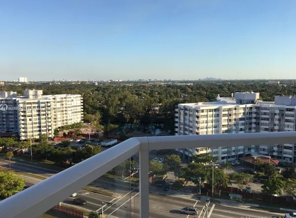 a view of a balcony with city