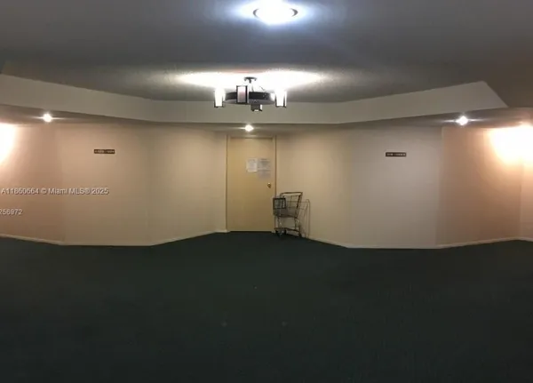 an empty room with wooden floor