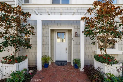 an entrance to house with yard