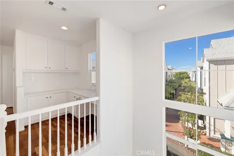 a view of wooden floor and a large window