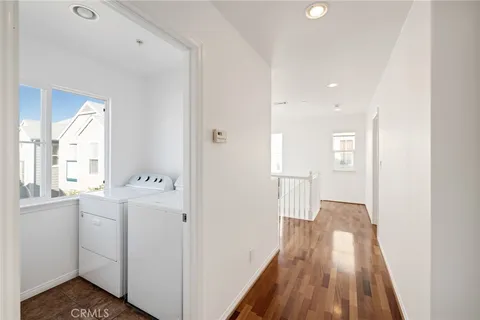 a view of hallway with wooden floor