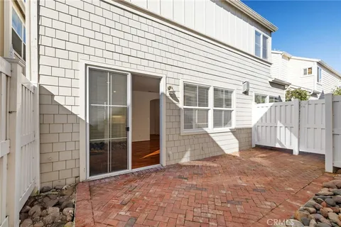 a view of a house with a door and wooden floor