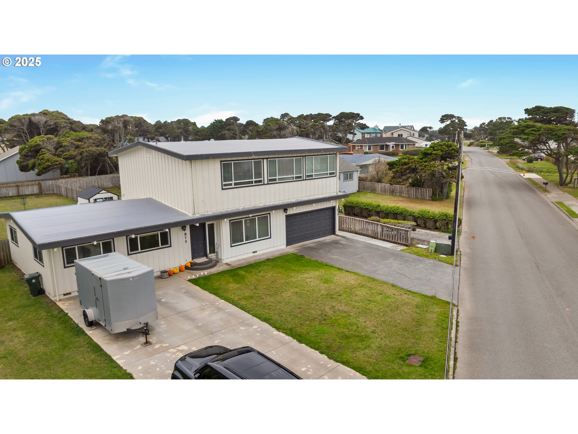 875 Ocean Drive Southwest Bandon, OR 97411 - Photo 1 of 31 a balcony with furniture and city view