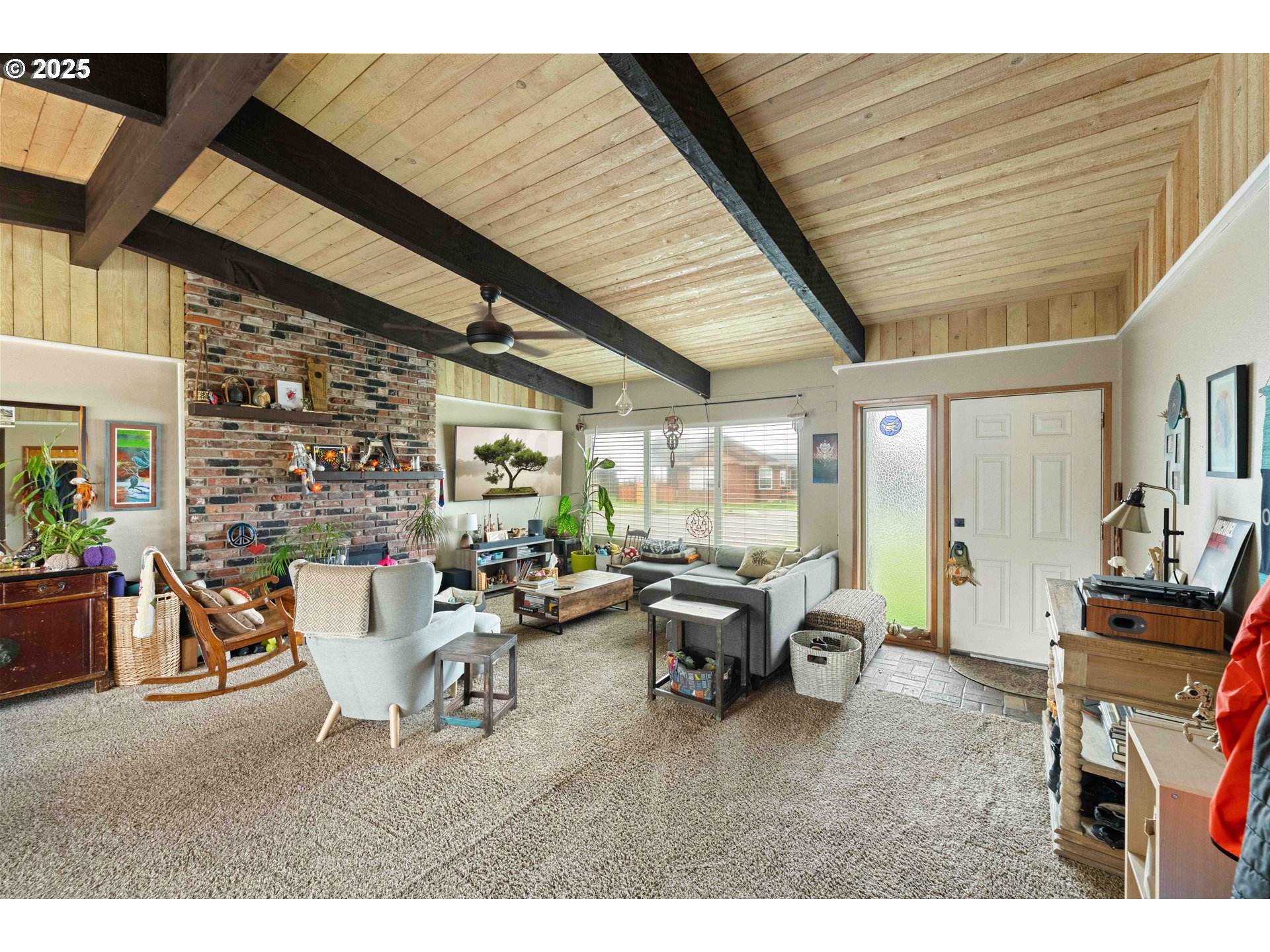 875 Ocean Drive Southwest Bandon, OR 97411 - Photo 15 of 31 a living room with furniture and a large window