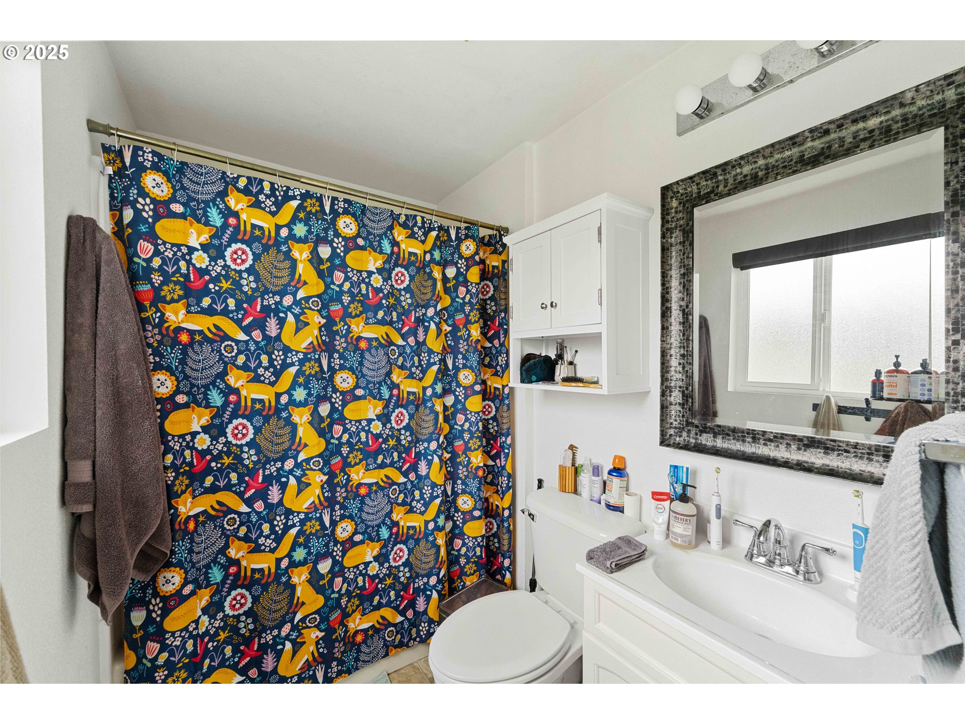 875 Ocean Drive Southwest Bandon, OR 97411 - Photo 23 of 31 a bathroom with a sink and a mirror