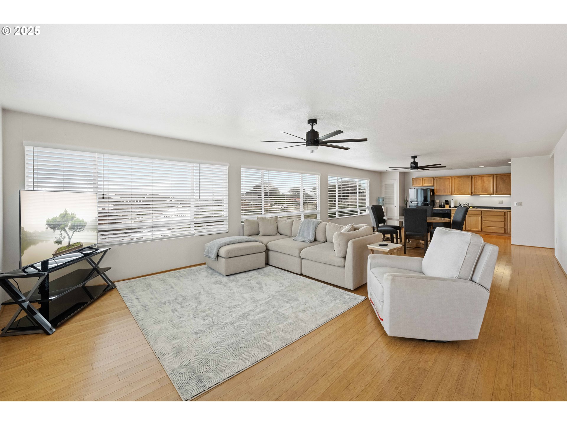 875 Ocean Drive Southwest Bandon, OR 97411 - Photo 5 of 31 a living room with furniture and a large window