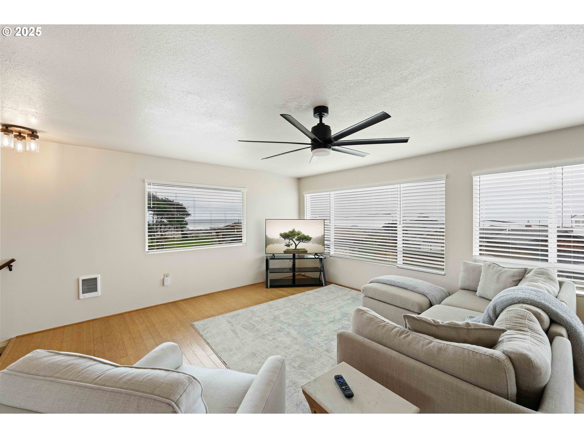 875 Ocean Drive Southwest Bandon, OR 97411 - Photo 6 of 31 a living room with furniture and a large window