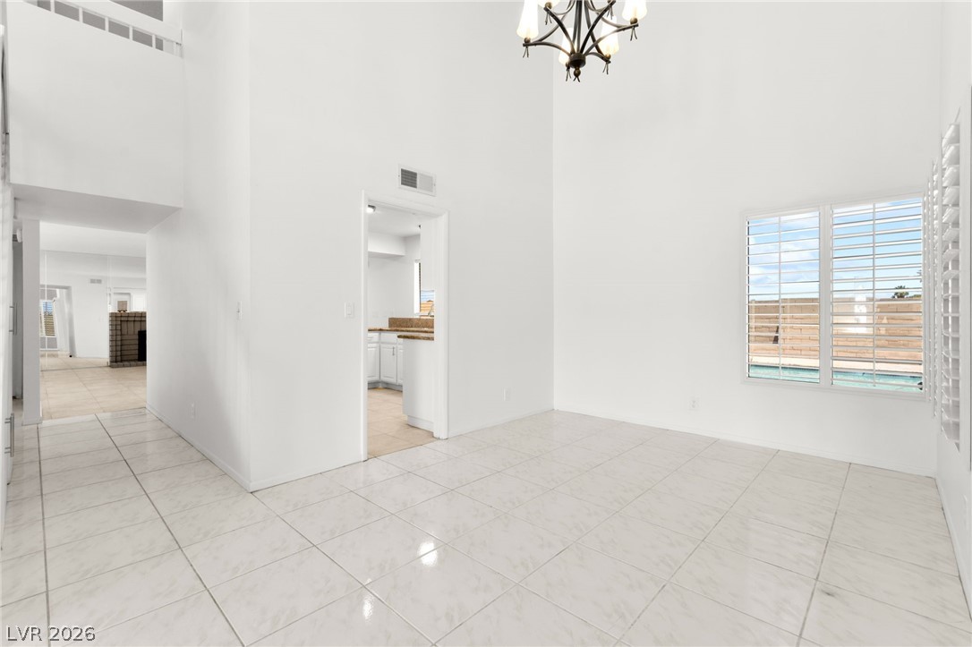 4430 Cranbrook Way Las Vegas, NV 89103 - Photo 10 of 50 A spacious, naturally illuminated room features high ceilings and a view of the pool.
