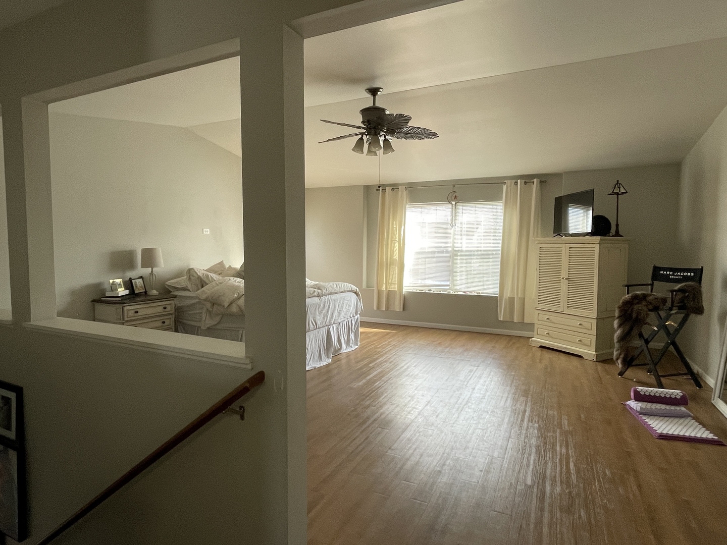 25328 Colligan Street Manhattan, IL 60442 - Photo 6 of 9 a view of a hallway to a livingroom with furniture hardwood floor and windows