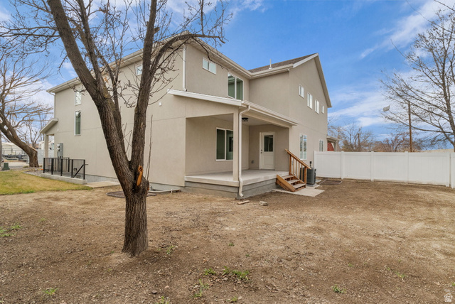 576 7th Avenue Midvale, UT 84047 - Photo 28 of 32 Rear view of house with stucco siding
