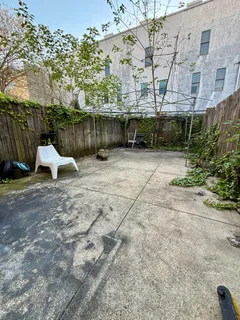a view of backyard with a table and chair