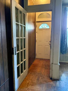 a view of front door with wooden floor