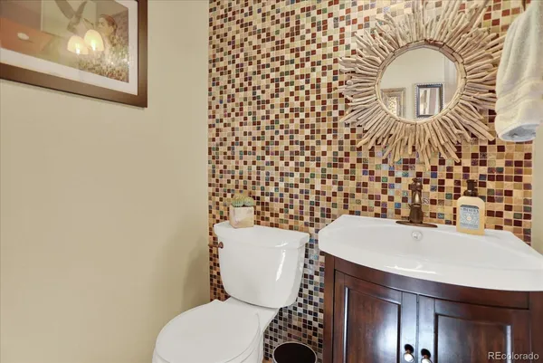 a bathroom with a toilet and a sink