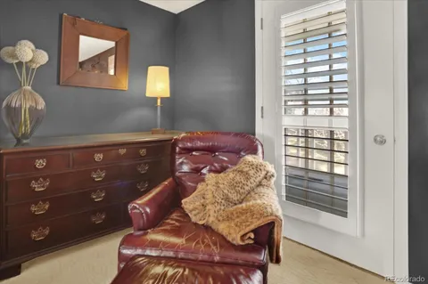 a bedroom with a bed and a mirror