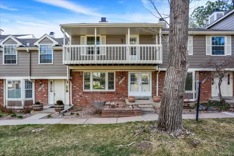 a front view of a house with patio and yard