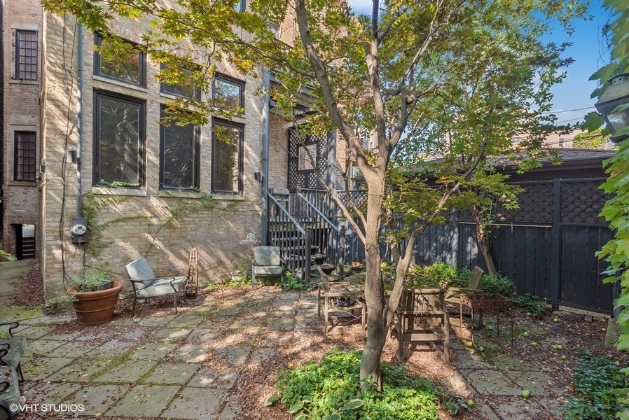 1823 North Lincoln Park West Chicago, IL 60614 - Photo 2 of 16 a view of a brick house with a yard