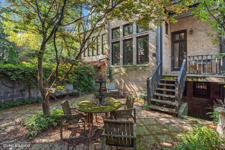 1823 North Lincoln Park West Chicago, IL 60614 - Photo 3 of 16 a backyard of a house with table and chairs