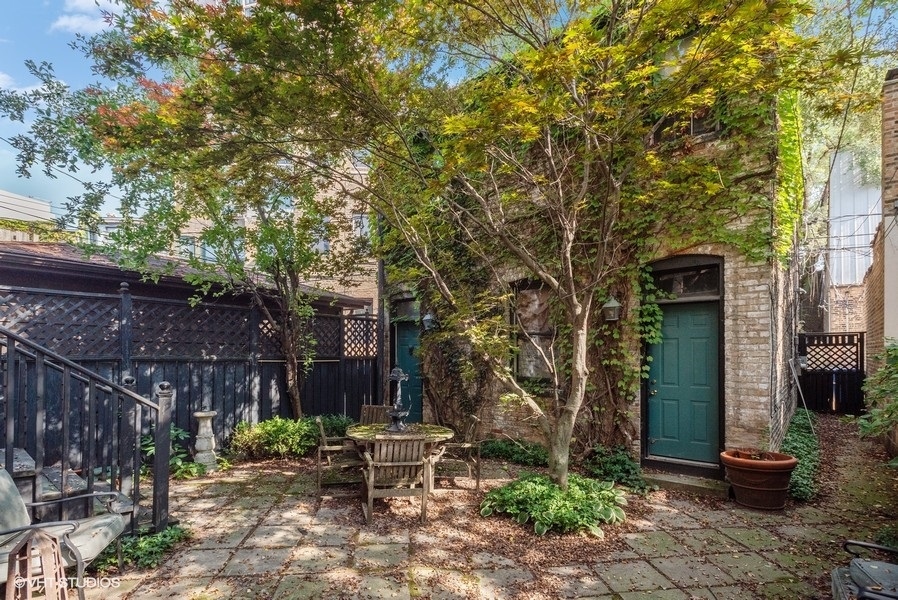1823 North Lincoln Park West Chicago, IL 60614 - Photo 5 of 16 a view of a chair and table in backyard of the house