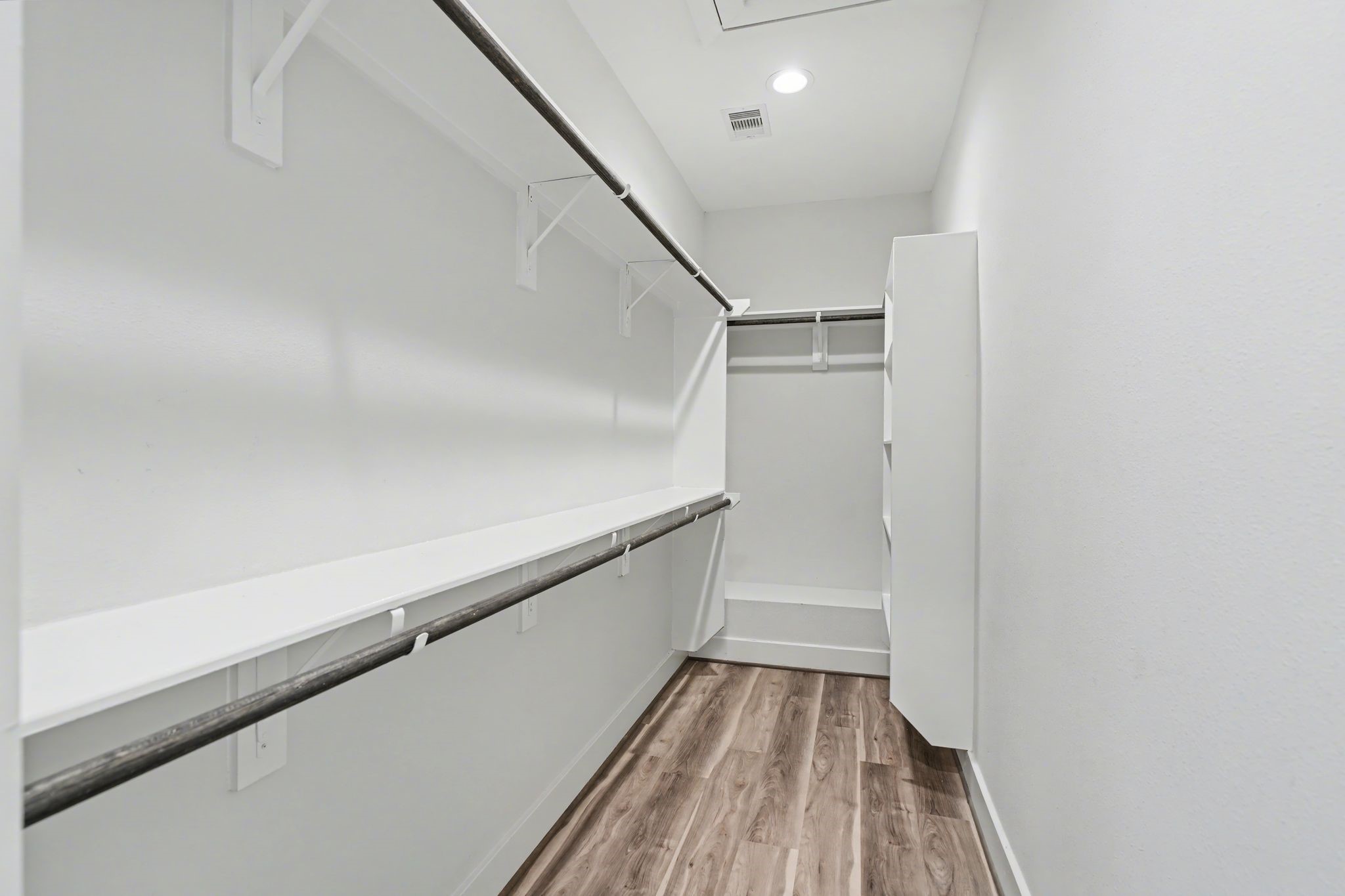 2504 West Tidwell Road, Unit B Houston, TX 77091 - Photo 21 of 24 A walk in closet in the primary
suite with built in storage.