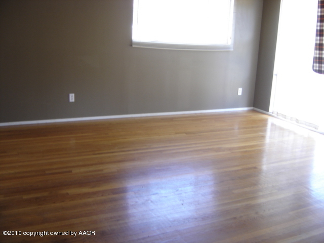 5012 South Bonham Street Amarillo, TX 79110 - Photo 3 of 5 a view of a room with wooden floor