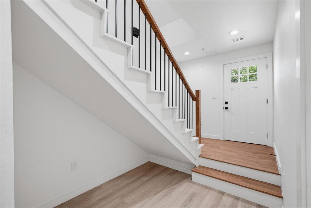 510 South O Connor Road Irving, TX 75060 - Photo 5 of 22 Entryway featuring a white paneled door with glass inserts, matte black hardware, and overhead recessed lighting