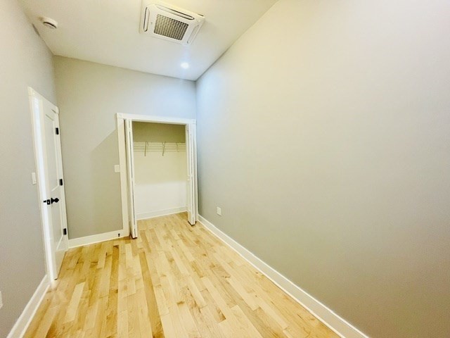 301 North Street, Unit 5 Boston, MA 02113 - Photo 13 of 18 a view of a room with wooden floor and a bathroom