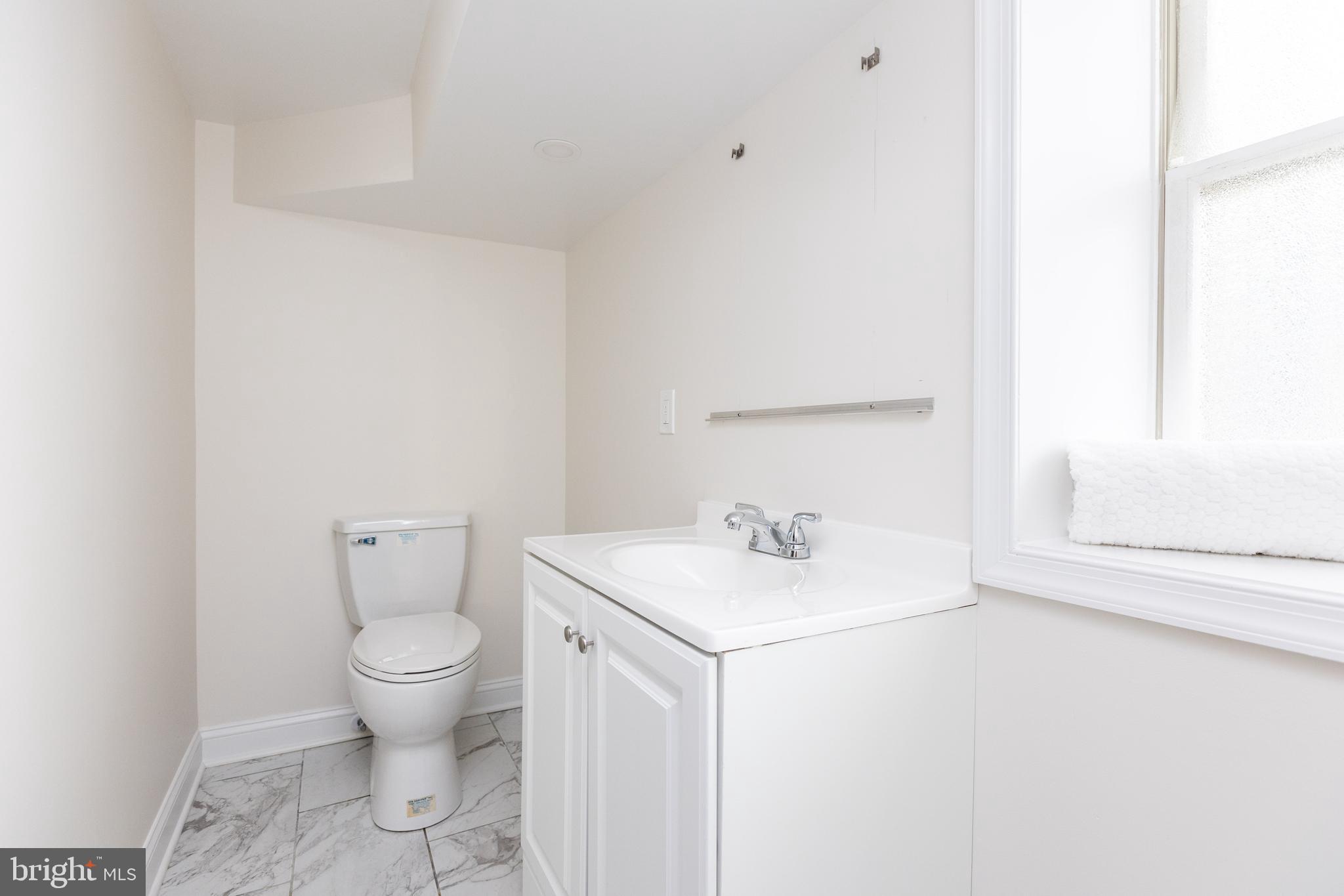 237 East 25th Street Baltimore, MD 21218 - Photo 33 of 41 Lower level 1/2 bath