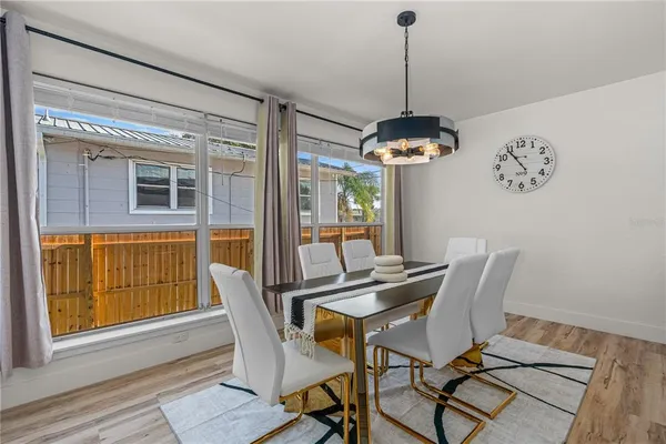 a view of a dining room and furniture wooden floor a chandelier