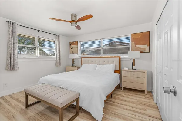 a bedroom with a bed and a walk in closet