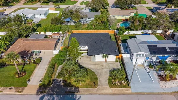 an aerial view of residential houses with swimming pool