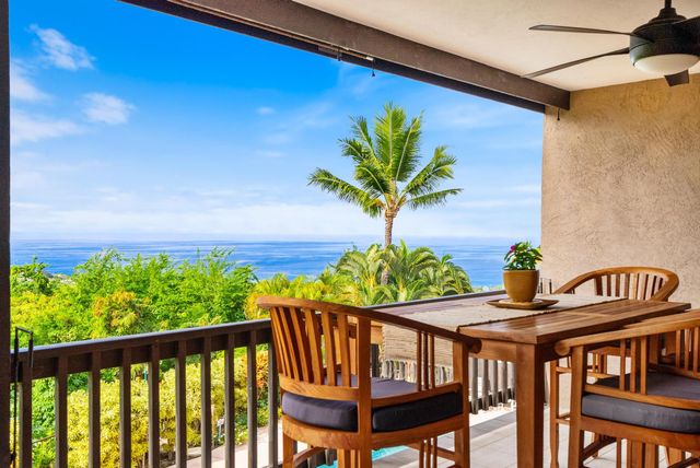 a view of a chairs and table on the wooden floor