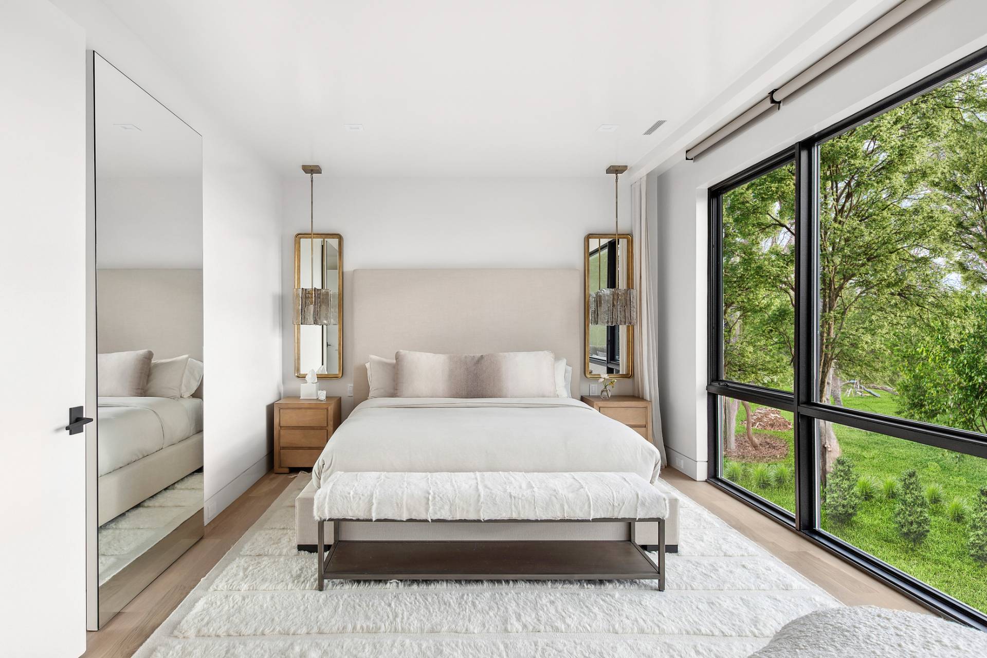 4 3rd Street Sag Harbor, NY 11963 - Photo 21 of 45 a bedroom with a large bed and a large window