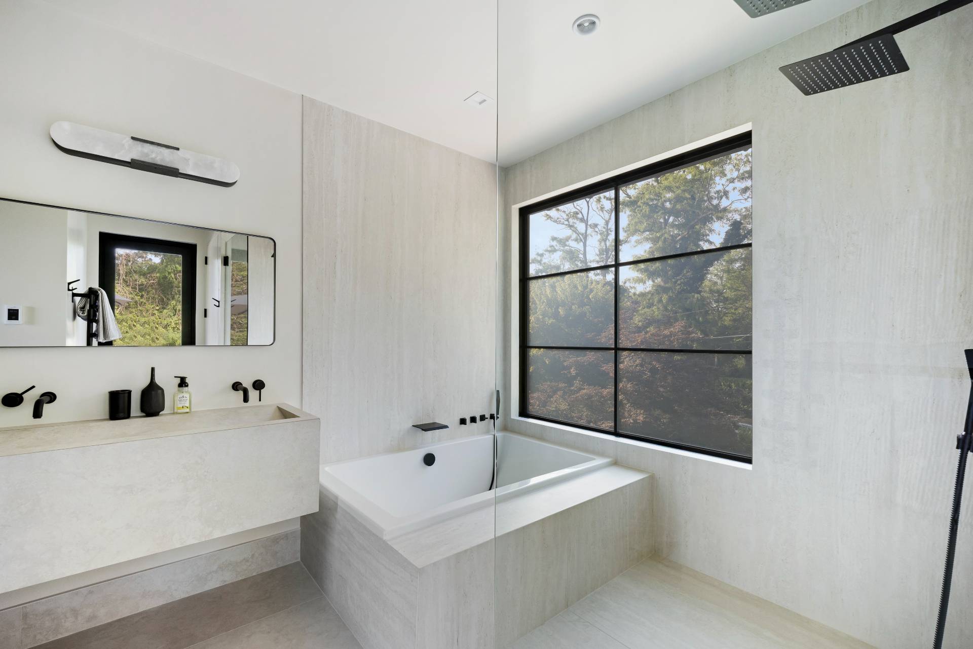 4 3rd Street Sag Harbor, NY 11963 - Photo 24 of 45 a bathroom with a bathtub and a sink