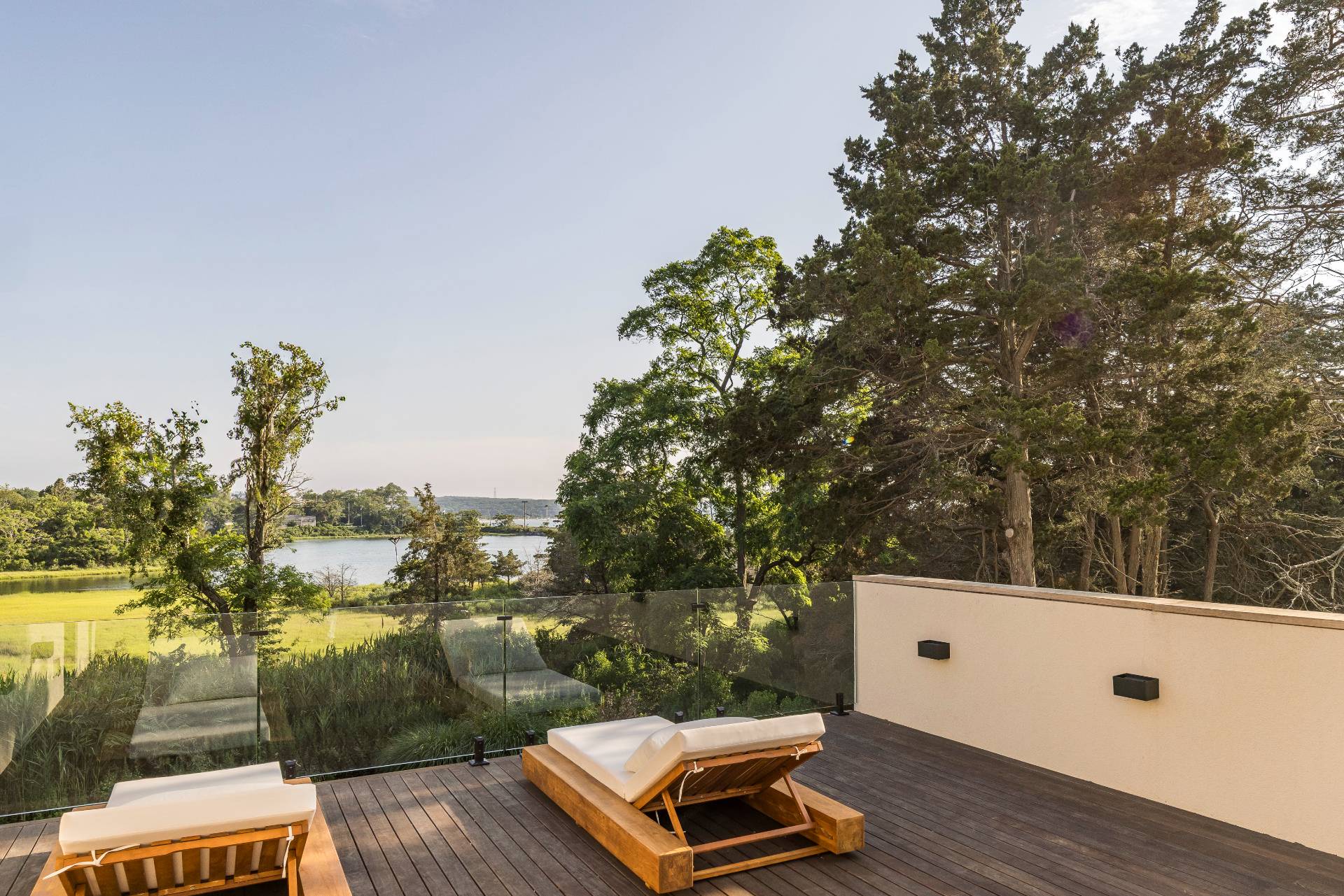 4 3rd Street Sag Harbor, NY 11963 - Photo 33 of 45 a view of balcony with wooden floor and yard