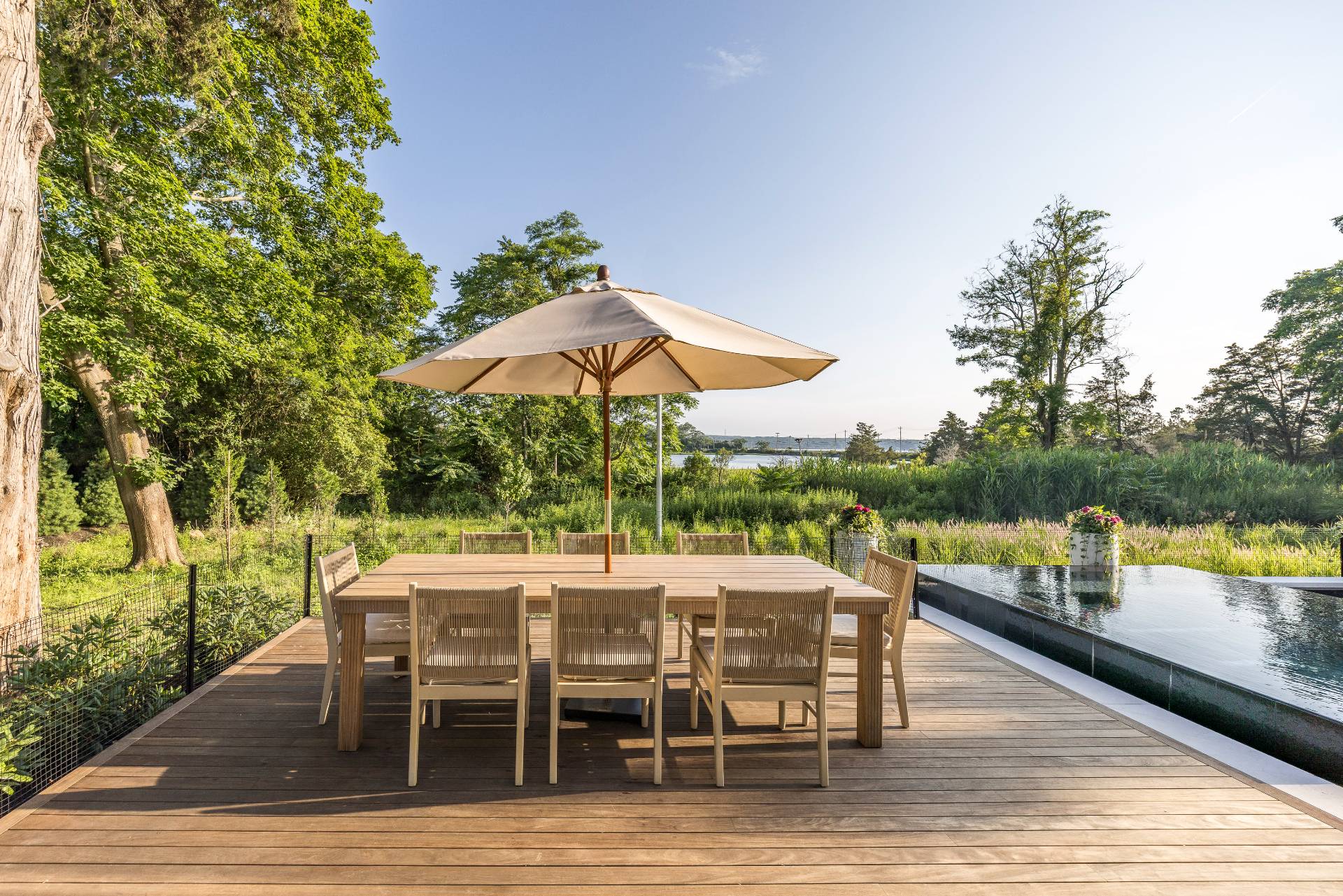 4 3rd Street Sag Harbor, NY 11963 - Photo 8 of 45 a view of a roof deck with table and chairs