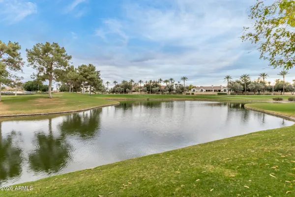 a swimming pool with outdoor seating and yard