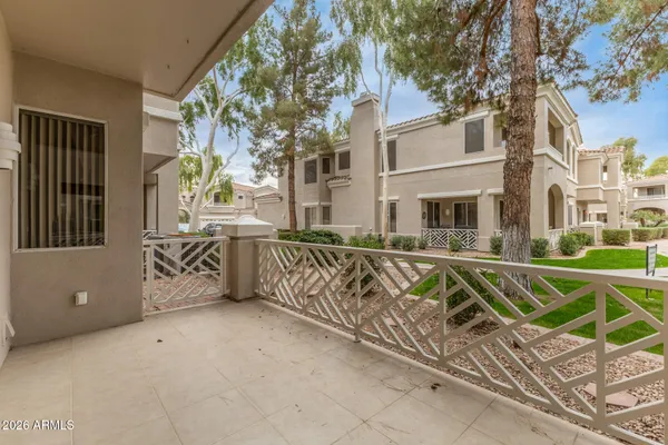a view of a street with a building in the background