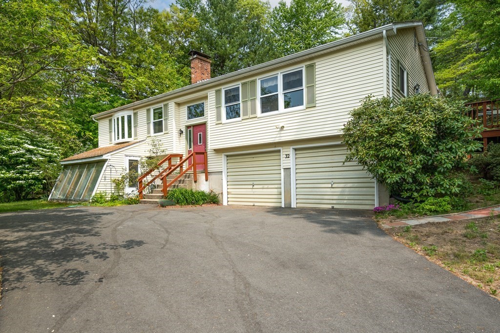 32 Middle Road Southampton, MA 01073 - Photo 1 of 39 a front view of a house with a yard and garage